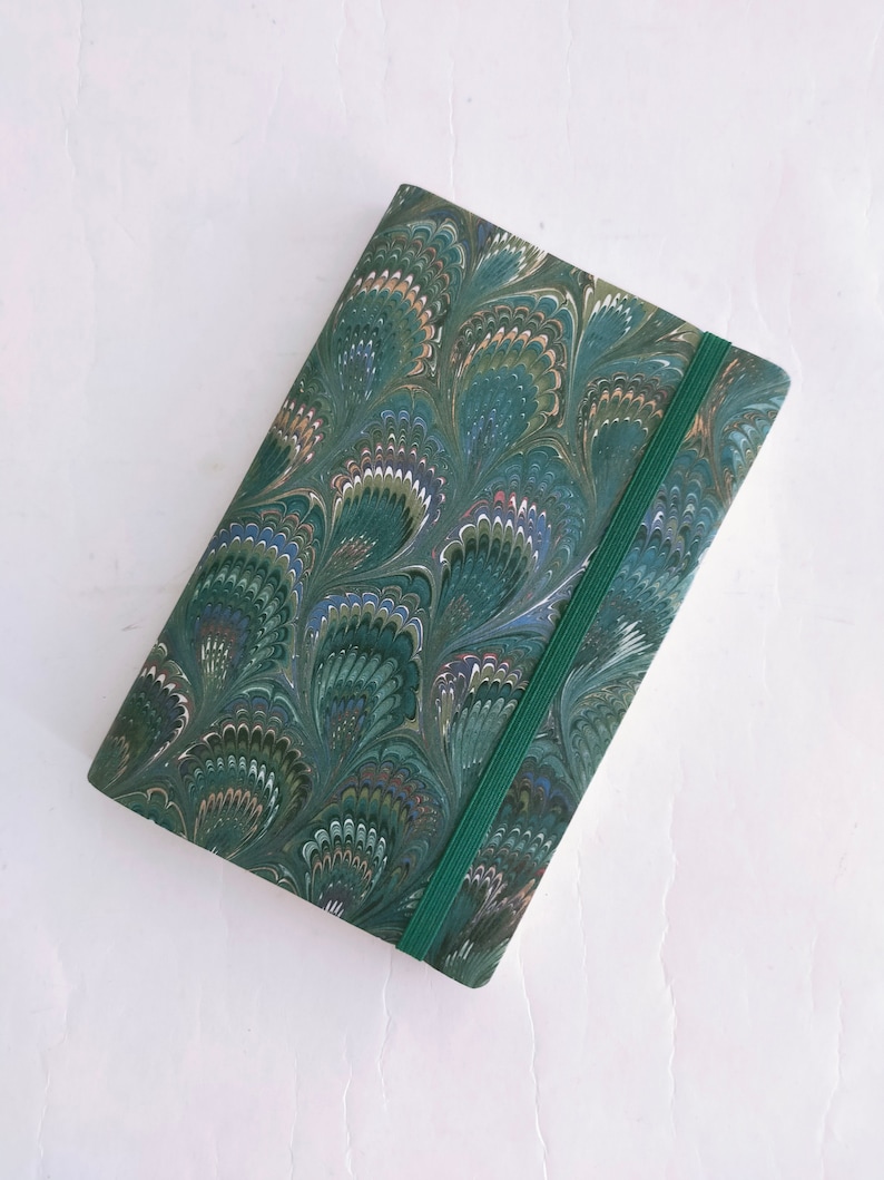 Green and red 100% recycled soft cover journal, hand marbled withbookmark and elastic band