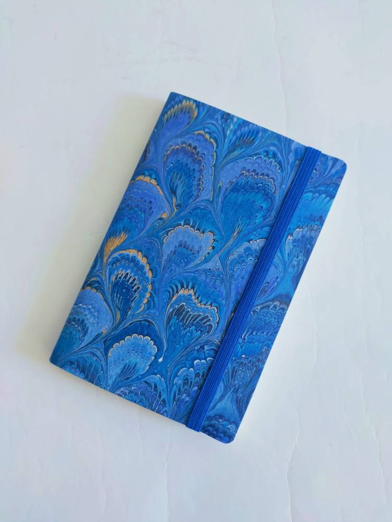Blue and gold 100% recycled soft cover journal, hand marbled withbookmark and elastic band