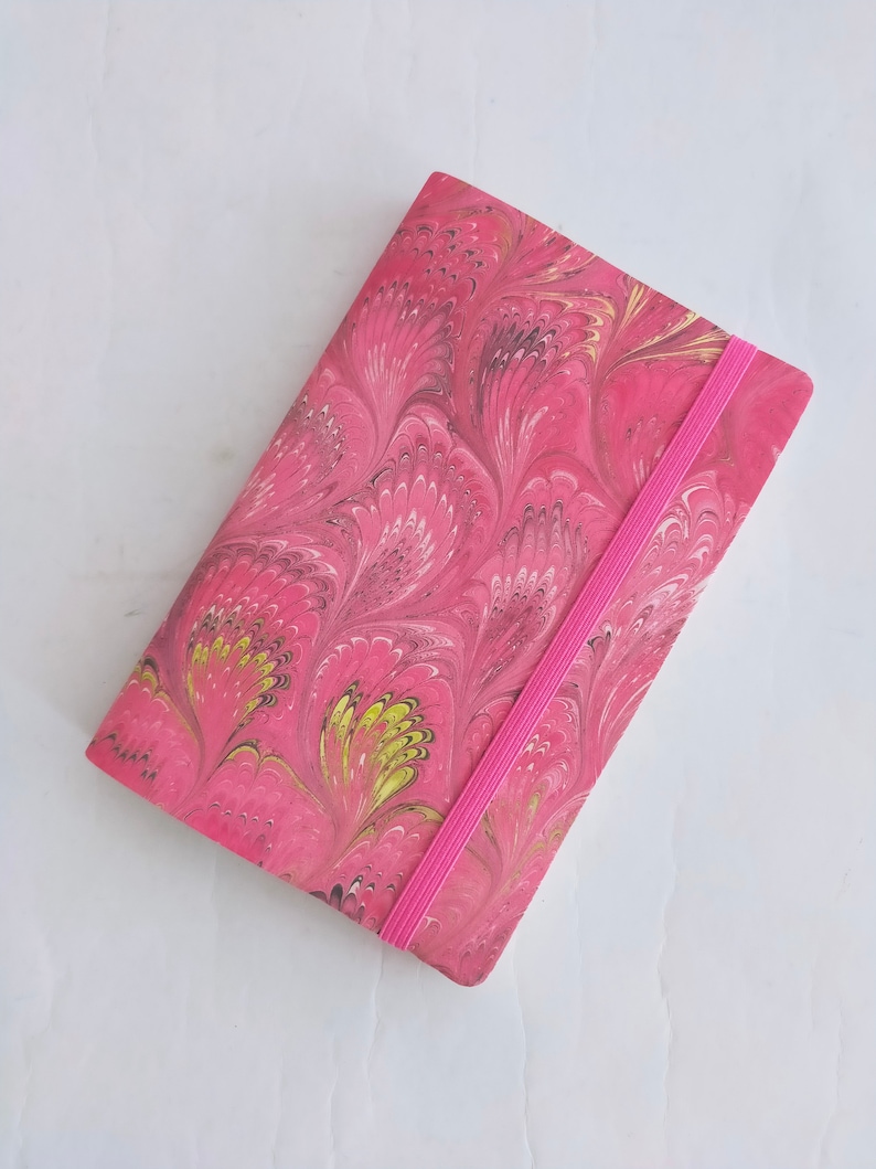 Pink 100% recycled soft cover journal, hand marbled withbookmark and elastic band