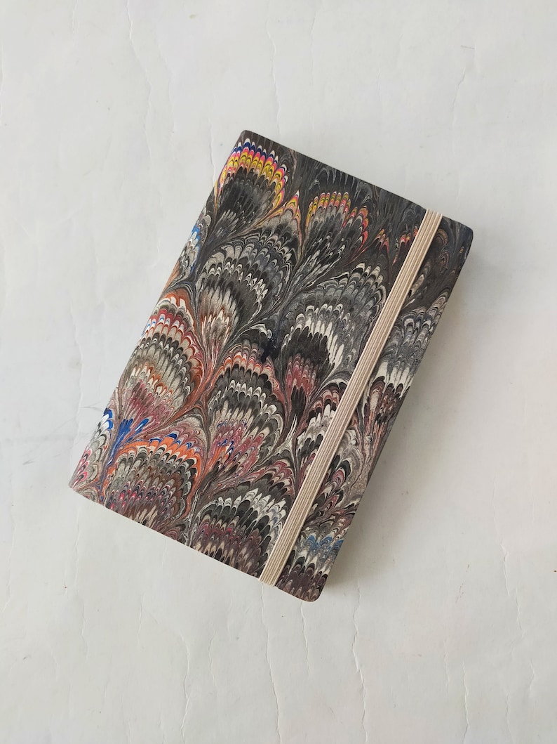 Multicolour 100% recycled soft cover journal, hand marbled withbookmark and elastic band