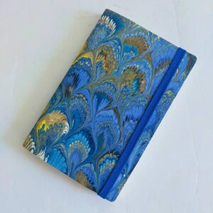 Green and blue 100% recycled soft cover journal, hand marbled withbookmark and elastic band