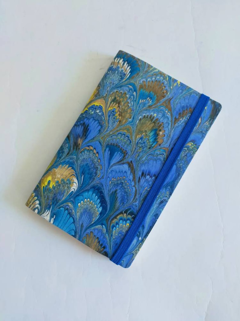 Green and blue 100% recycled soft cover journal, hand marbled withbookmark and elastic band