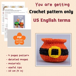 May include: A digital PDF crochet pattern for a small orange and black pot with a yellow buckle. The document includes four pages of instructions, detailed images, a materials list, and useful tips. The finished item measures 10 cm or 4 inches.
