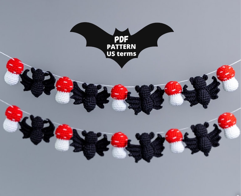 There is a halloween garladn with small black bats and small red and white mushrooms. There is a stamp indicating that this is a crochet pattern