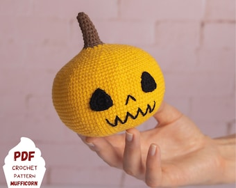 May include: Crochet pattern for a yellow pumpkin with a black face. The pattern is available as a PDF download.