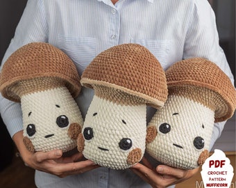 May include: Three plush mushroom-shaped pillows with smiling faces. The mushroom caps are brown, the stems are white, and they have black eyes and small brown cheeks. The pillows are handmade and appear soft and cuddly.