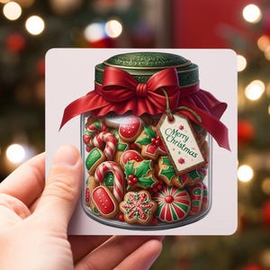May include: A glass jar filled with Christmas cookies, decorated with red and green icing. The jar is tied with a red ribbon and a tag that says "Merry Christmas".
