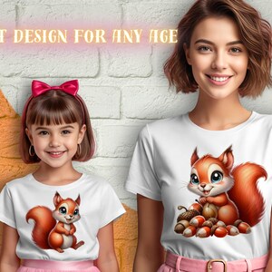 May include: Two white t-shirts with a cartoon squirrel design. The squirrel is holding an acorn and surrounded by other acorns. The text "GREAT DESIGN FOR ANY AGE" is at the top of the image.