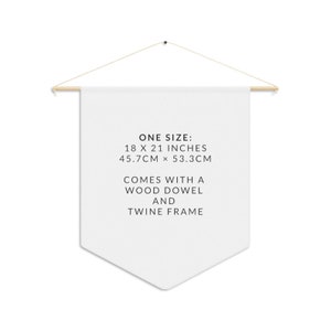 May include: White canvas tapestry with black text that reads "ONE SIZE: 18 X 21 INCHES 45.7CM &times; 53.3CM COMES WITH A WOOD DOWEL AND TWINE FRAME".