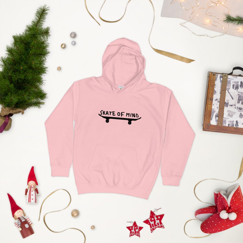 May include: Pink hooded sweatshirt with a black graphic of a skateboard and the text "Skate of Mind".