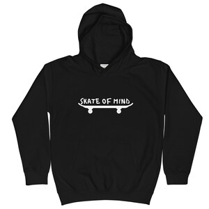 May include: Black hooded sweatshirt with a white graphic of a skateboard and the text "Skate of Mind".