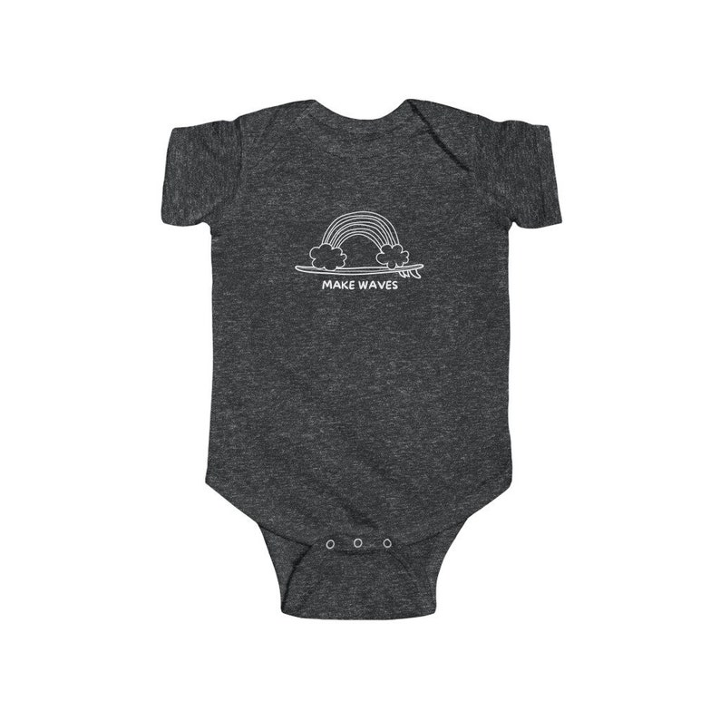 May include: A dark grey baby onesie with a white graphic of a rainbow over a surfboard with the text "MAKE WAVES".