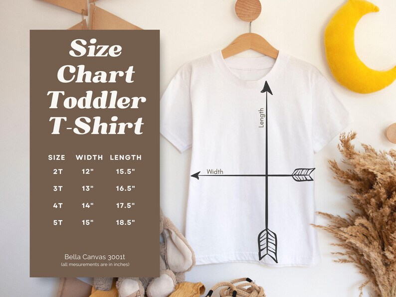 May include: Size chart for toddler t-shirts with measurements in inches. The chart shows the width and length of the shirts in sizes 2T, 3T, 4T, and 5T. The chart is printed on a brown background. The text "Bella Canvas 3001t" is printed at the bottom of the chart.