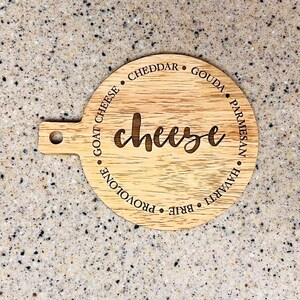 This adorable miniature charcuterie board will give any kitchen or dining area a sweet and personalized touch. These are small and Measure 5” Wide x 6.75” Tall.