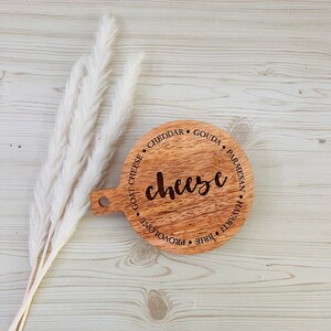 This adorable miniature charcuterie board will give any kitchen or dining area a sweet and personalized touch. These are small and Measure 5” Wide x 6.75” Tall.