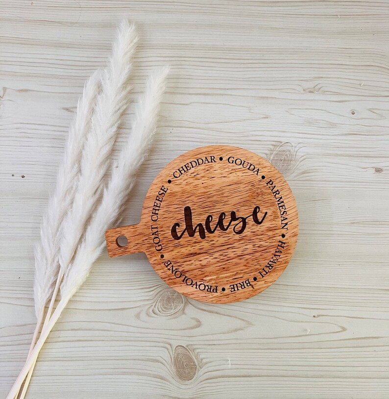 This adorable miniature charcuterie board will give any kitchen or dining area a sweet and personalized touch. These are small and Measure 5” Wide x 6.75” Tall.