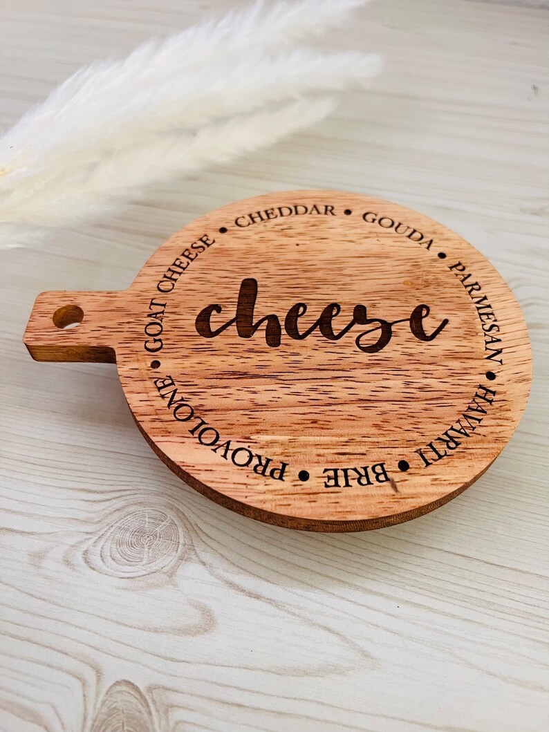 This adorable miniature charcuterie board will give any kitchen or dining area a sweet and personalized touch. These are small and Measure 5” Wide x 6.75” Tall.