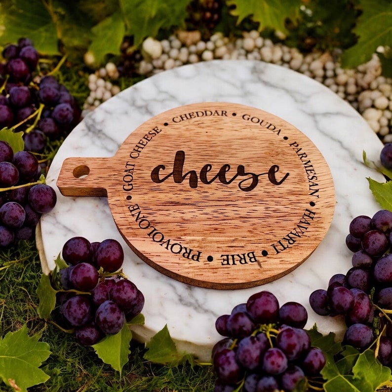 This adorable miniature charcuterie board will give any kitchen or dining area a sweet and personalized touch. These are small and Measure 5” Wide x 6.75” Tall.