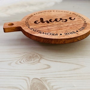 This adorable miniature charcuterie board will give any kitchen or dining area a sweet and personalized touch. These are small and Measure 5” Wide x 6.75” Tall.