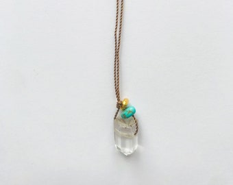 A minimalist pendant of a small Quartz point combined with Turquoise pebble and a gold nugget | Crystal jewelry