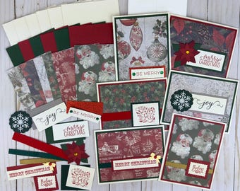 May include: A collection of Christmas greeting cards and paper craft supplies featuring festive patterns of Santa Claus, poinsettias, snowflakes, and ornaments. The cards include text such as Merry Christmas, Be Merry, Joy, and Season to be Jolly.