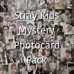 May include: A collection of Stray Kids photocard packs. The image features a variety of photocards with different members of the K-pop group. The text "Stray Kids Mystery Photocard Pack" is overlaid on the image.