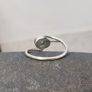 May include: A silver ring with a round gemstone. The ring is marked with "925" and "Silverindex".