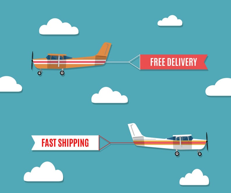 May include: Two small airplanes flying in a blue sky with white clouds. One plane is orange and pulls a banner that reads "FREE DELIVERY." The other plane is white and pulls a banner that reads "FAST SHIPPING."