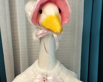 Bunny - Mrs. Goose is collecting all the lucky eggs in her fancy basket.