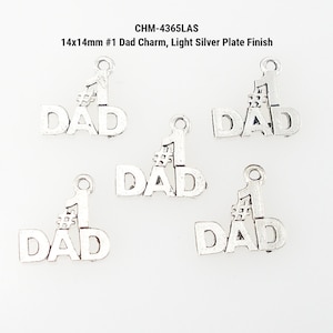 May include: Five light silver-colored metal charms. Each charm spells "DAD" with a "#1" symbol above the "D". The charms are 14mm x 14mm. The text "CHM-4365LAS" and "Light Silver Plate Finish" are also visible.