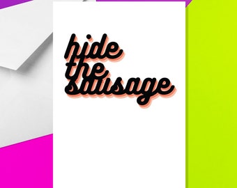 May include: A white greeting card with the phrase "hide the sausage" in black script with a peach shadow. The card is next to a white envelope, set against a purple and green background.