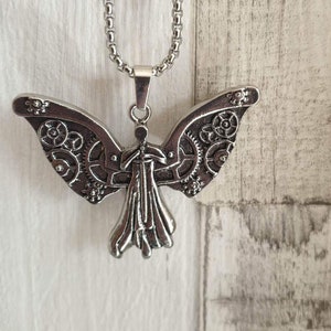 Clockwork angel necklace that ticks discount