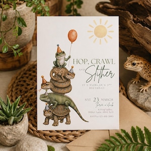 May include: A rectangular birthday invitation card featuring a watercolour illustration of a stack of reptiles and amphibians wearing party hats, with an orange balloon and a yellow sun. Text reads: HOP, CRAWL AND SLITHER, IT'S MORGAN'S 3RD BIRTHDAY.