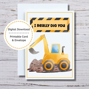 May include: A printable card featuring a yellow digger excavating dirt. The card has a black and yellow striped banner with the text "I really dig you".