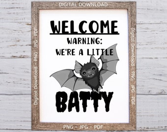 May include: A black and white printable sign with a bat illustration and the text "Welcome Warning: We're a little Batty".