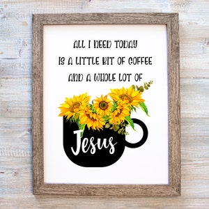 Pode incluir: Uma caneca de café preta com girassóis e vegetação, com o texto "ALL I NEED TODAY IS A LITTLE BIT OF COFFEE AND A WHOLE LOT OF Jesus" em texto preto.