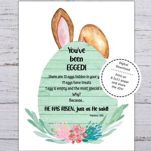 May include: A green and white Easter egg with bunny ears and a floral design. The text reads "You've been EGGED!" and "HE HAS RISEN, just as He said! Matthew 28:6".