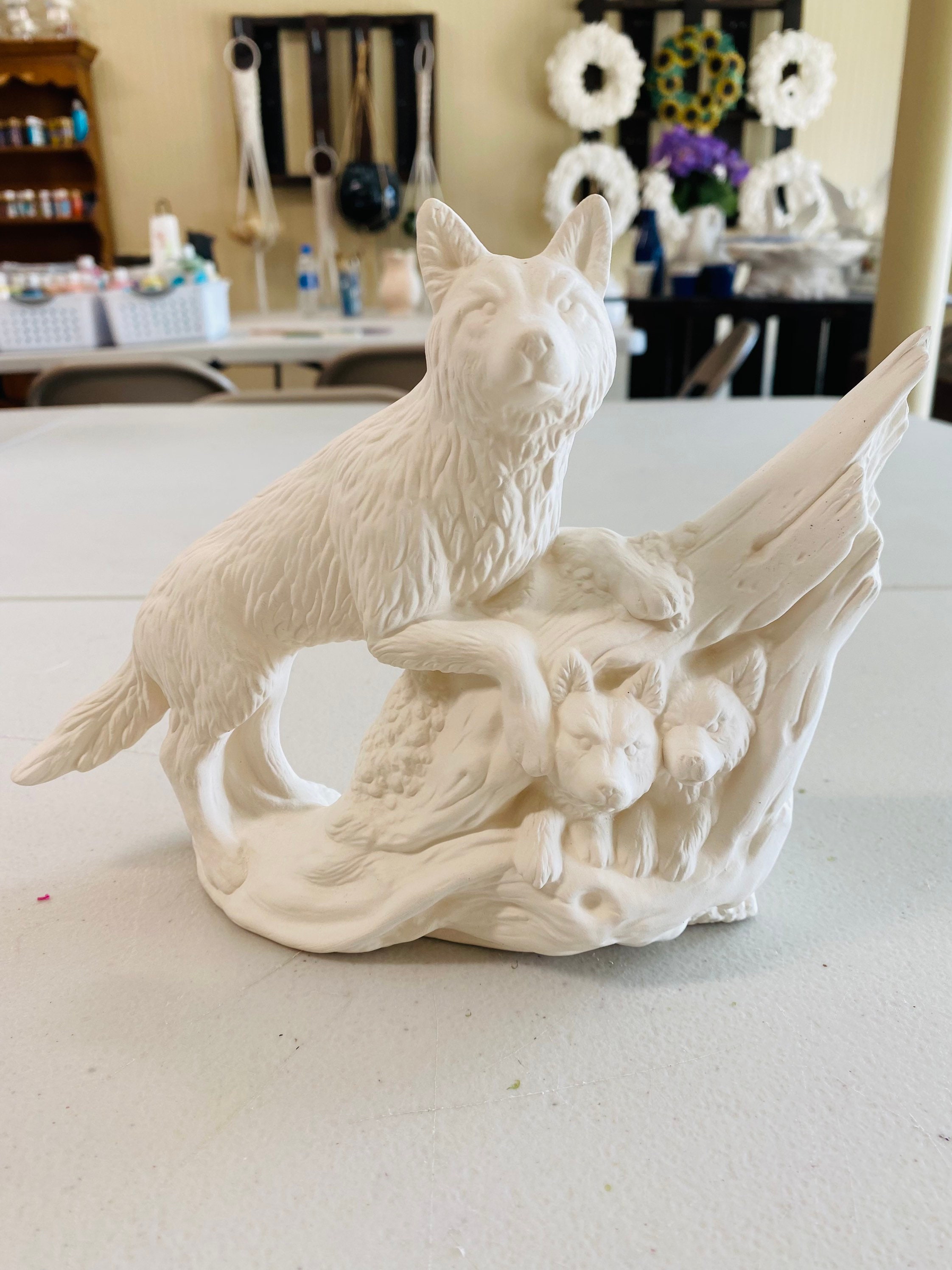 ceramic wolf statue