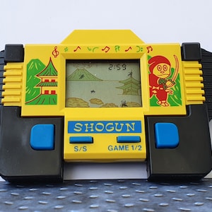 VINTAGE LCD Electronic Action Game Motorcycle by PEKA Toys 90s 