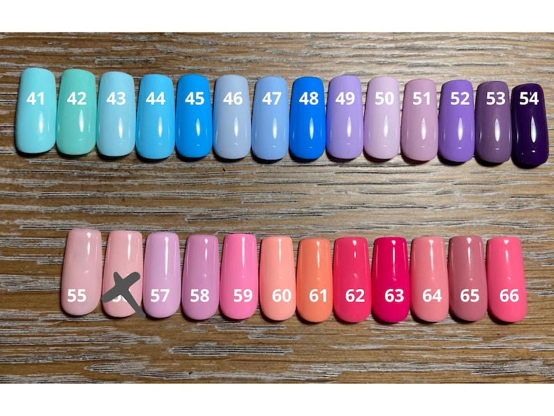 May include: A row of 11 small bottles of nail polish in shades of blue, purple, and pink, followed by a row of 11 small bottles of nail polish in shades of pink, orange, and red. The bottles are numbered 41 through 66.