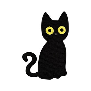 May include: Black embroidered cat patch with yellow eyes. The cat is sitting with its tail curled around its body.