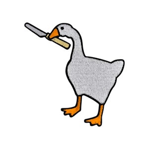 May include: A white goose with orange feet holding a knife in its beak. The goose is standing on a white background.