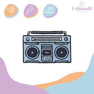 May include: A blue embroidered iron-on patch of a vintage boombox cassette player. The patch is ideal for adding a retro touch to clothing, bags, or other accessories.
