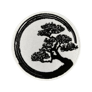 May include: Circular embroidered patch featuring a black bonsai tree design within a black and white circle. The bonsai tree is detailed with black thread, set against a white background, creating a striking contrast. The patch is suitable for jackets, bags, or other fabric items.