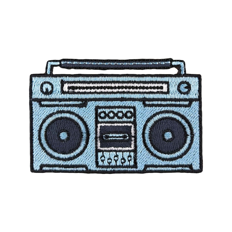 May include: A light blue boombox with a black handle, black speakers, and a black cassette player.