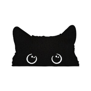 May include: Black felt patch with a silhouette of a cat's face with white embroidered eyes.