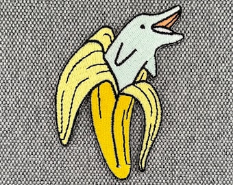 Patch Urbanski rigolo dauphin dans une banane à repasser 8 x 5 cm | Image thermocollante pour application d'un patch