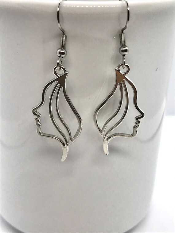 Metal face hotsell earrings