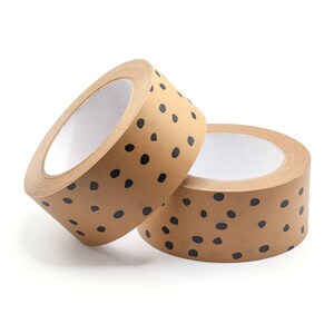 May include: Two rolls of brown packing tape with a black polka dot pattern. The tape is on a white background.