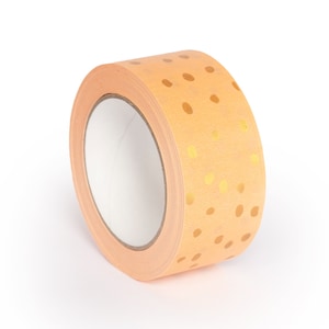 May include: A roll of orange washi tape with a gold polka dot pattern.